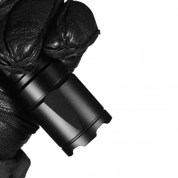 black glove holding a black tactical flashlight camping lanterns